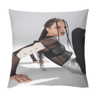 Personality  Woman With Braids Sitting In Futuristic Outfit On White Surface And Grey Background Pillow Covers