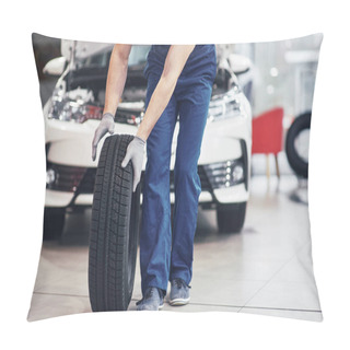 Personality  Mechanic Holding A Tire Tire At The Repair Garage. Replacement Of Winter And Summer Tires. Pillow Covers