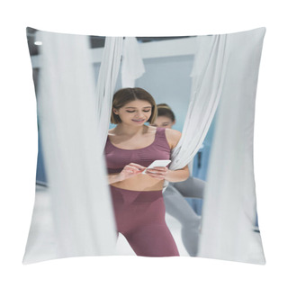 Personality  Young Sportswoman Using Smartphone Near Fly Yoga Straps On Blurred Foreground  Pillow Covers