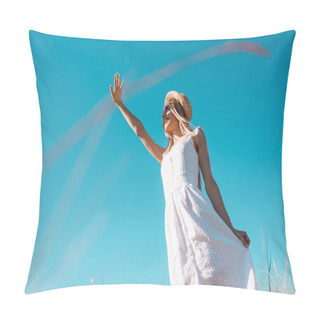 Personality  Low Angle View Of Stylish Woman In White Dress Waving Hand While Looking Away Against Blue Sky, Selective Focus Pillow Covers