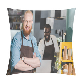Personality  Young Smiling Male Barista In Apron With Colleague Using Laptop Behind Pillow Covers