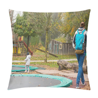Personality  Mother And Daughter Walking Through Children Playground With Trampolines. Pillow Covers