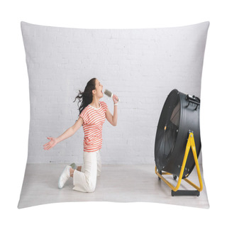 Personality  Side View Of Young Woman Singing And Holding Hairbrush While Kneeling Near Electric Fan At Home  Pillow Covers
