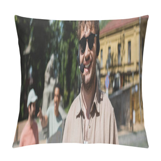 Personality  Portrait Of Young Tour Guide In Headset And Sunglasses Near Blurred Interracial Tourists On Andrews Descent In Kyiv, Banner Pillow Covers