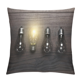 Personality  Glowing Bulb Uniqueness Concept On Wooden Background Pillow Covers