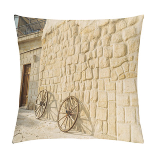 Personality  Front View Of Wooden Wheels And Stone Building In Cappadocia, Turkey  Pillow Covers