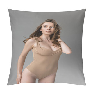 Personality  Portrait Of Fashionable Young Woman With Brunette Hair And Natural Makeup Touching Hip While Posing In Sexy Beige Bodysuit Isolated On Grey   Pillow Covers