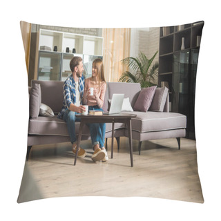 Personality  Young Couple Sitting On Couch With Cups In Living Room With Modern Design Pillow Covers
