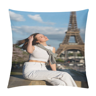 Personality  Young Stylish Woman With Closed Eyes Adjusting Hair And Sitting Near Eiffel Tower In Paris, France Pillow Covers