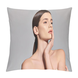 Personality  A Young Woman With Brunette Hair Striking A Pose With Her Hand On Her Face In A Studio Setting On A Grey Background. Pillow Covers