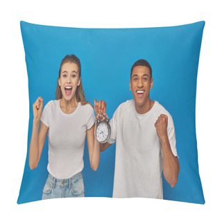 Personality  Excited Interracial Couple With Open Mouth Holding Alarm Clock On Blue Background, Face Expression Pillow Covers