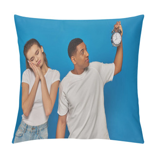 Personality  Morning Time, African American Man Holding Alarm Clock Near Sleepy Woman On Blue Background Pillow Covers