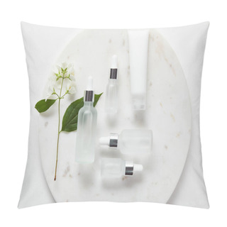 Personality  Top View Of Cream Tube And Cosmetic Glass Bottles In Plate With Jasmine On White Surface Pillow Covers