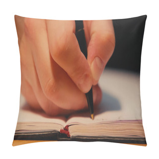 Personality  Cropped View Of Man Holding Pen While Writing In Copy Book On Desk Pillow Covers