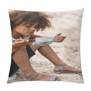 Personality  Curly African American Kid Holding Dirty Medical Mask While Sitting On Ground  Pillow Covers