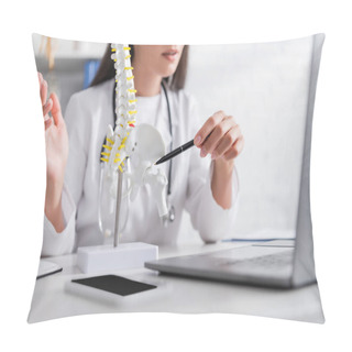 Personality  Cropped View Of Doctor Pointing At Spinal Model Near Blurred Laptop In Hospital  Pillow Covers