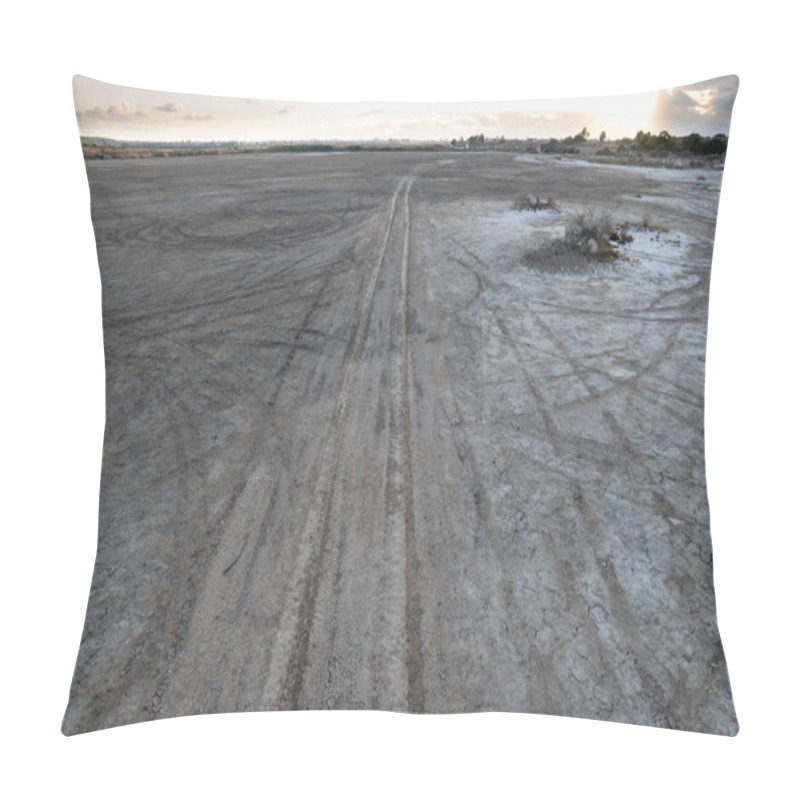 Personality  Drone aerial of deserted rural road at sunset in a dry lake. Concept of environmental ecological climate change. pillow covers