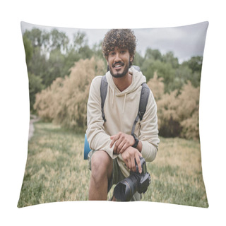 Personality  Joyful Indian Photographer Holding Professional Camera And Looking At Camera In Forest During Trip Pillow Covers
