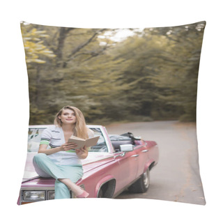 Personality  Smiling Woman Looking At Camera While Sitting On Hood Of Cabriolet And Holding Book Pillow Covers
