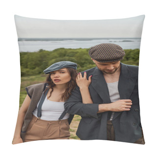 Personality  Fashionable Brunette Woman In Suspenders And Newsboy Cap Touching Bearded Boyfriend In Jacket And Looking At Camera With Blurred Nature At Background, Stylish Pair Amidst Nature Pillow Covers