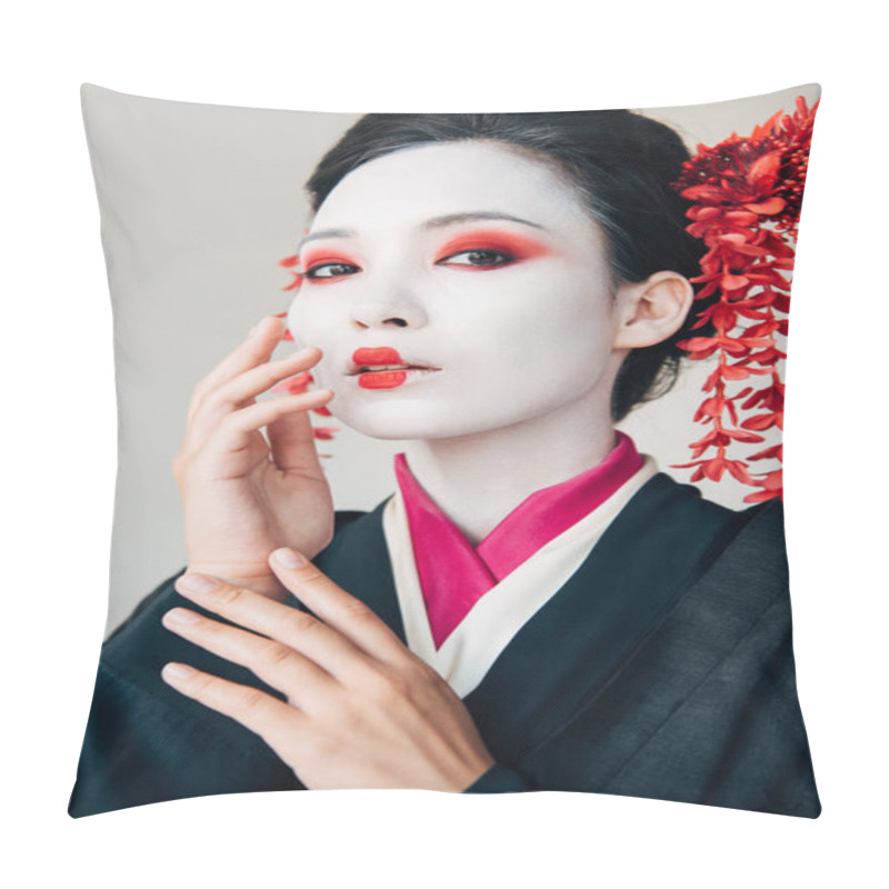 Personality  beautiful geisha in black kimono with red flowers in hair touching face isolated on white pillow covers