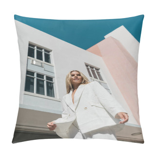 Personality  A Young, Beautiful Blonde Woman In A White Suit Stands Confidently In Front Of A Striking Urban Building. Pillow Covers