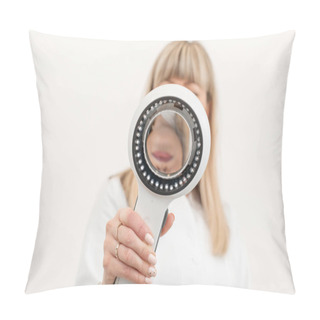 Personality  Portrait Of A Doctor Trichologist Dermatologist Looking At A Dermatoscope. Focus On The Hand With A Dermatoscope, The Doctor Is Blurred. In A Bright Cosmetology Room. Pillow Covers