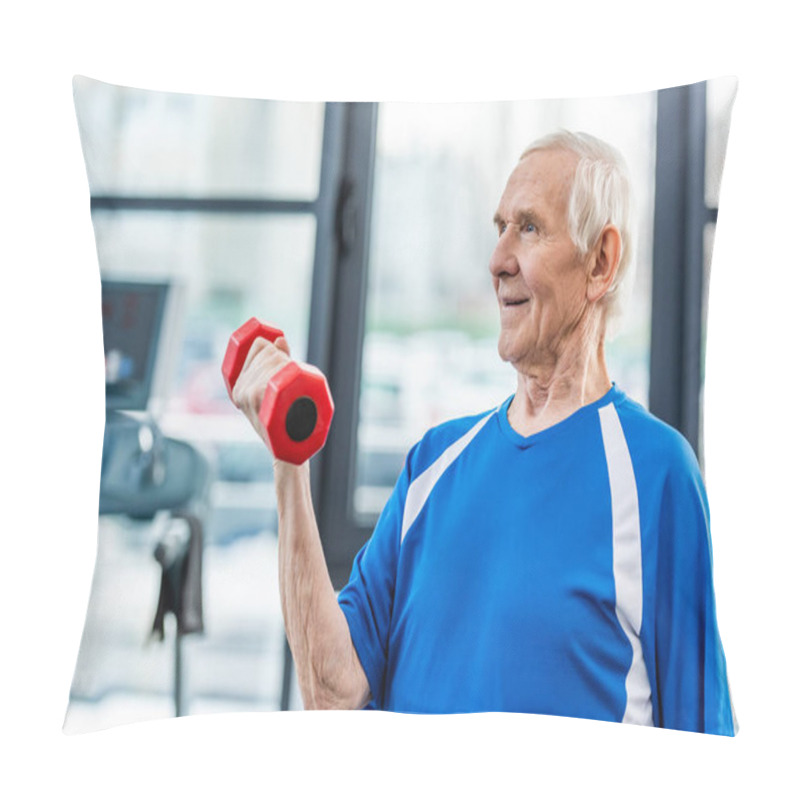 Personality  happy senior sportsman exercising with dumbbell at gym pillow covers