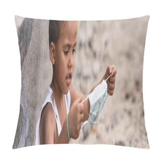 Personality  Panoramic Shot Of Poor African American Kid Holding Dirty Medical Mask Outside Pillow Covers