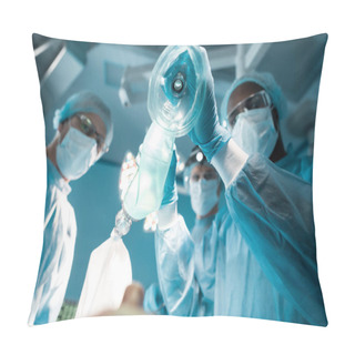 Personality  Bottom View Of African American Anesthetist Holding Oxygen Mask Above Patient In Surgery Room Pillow Covers