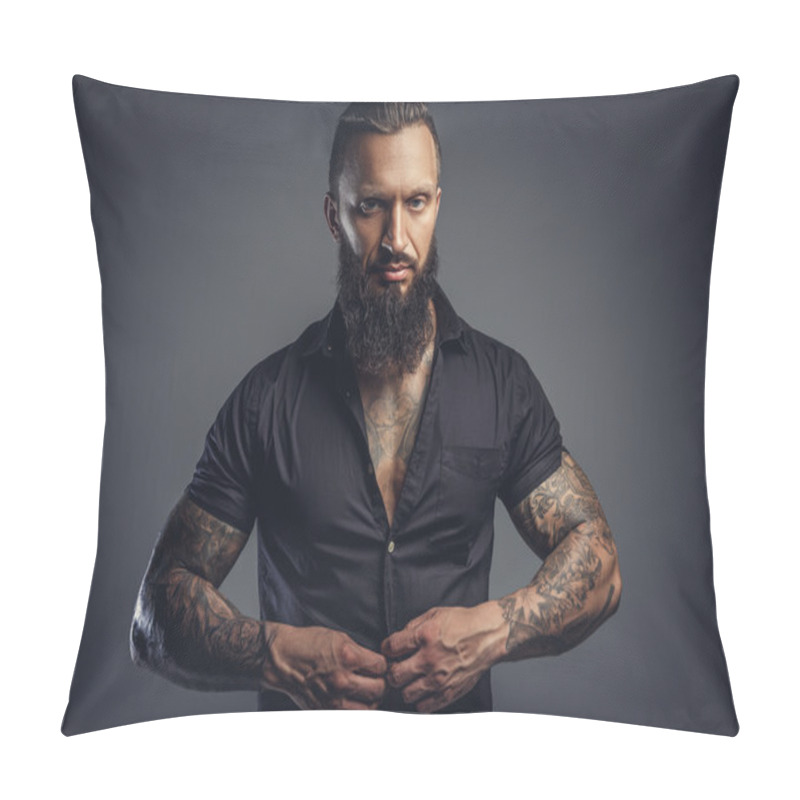 Personality  Tattooed male taking off his shirt pillow covers