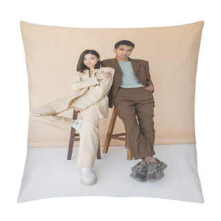 Personality  Full Length Of Young Multiethnic Couple In Stylish Suits Posing Near Stools On Beige Background Pillow Covers