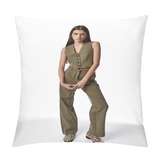 Personality  A Stylish Woman With Long Dark Hair Striking A Pose In A Fashionable Jumpsuit Against A Gray Backdrop. Pillow Covers