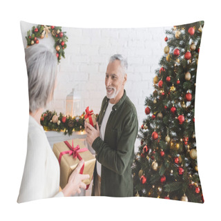 Personality  Smiling Middle Aged Man Holding Present And Looking At Wife Near Christmas Tree Pillow Covers