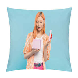 Personality  Positive Emotion, Young, Amazed And Delighted Asian Woman With Dyed Red Hair, In Orange Shirt Opening Gift Box With Festive Present On Blue Background, Surprise, Joy, Happiness Pillow Covers