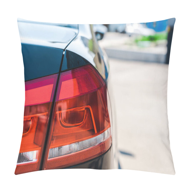 Personality  selective focus of red and shiny tail light of black and modern car  pillow covers