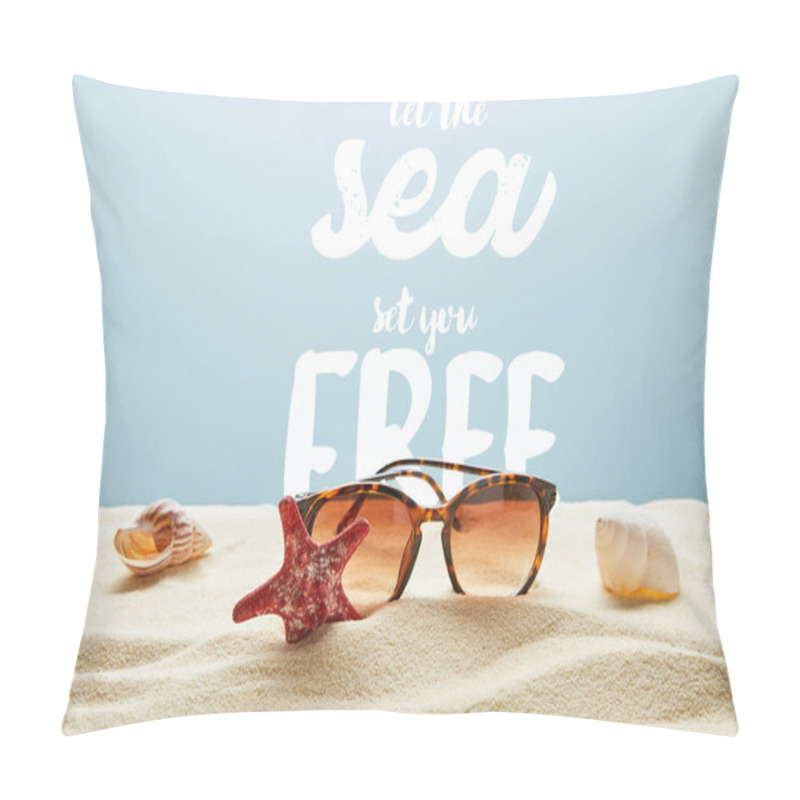 Personality  brown stylish sunglasses on sand with seashells and starfish on blue background with let the sea set you free lettering pillow covers