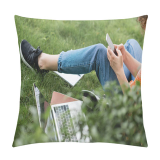 Personality  Cropped View Of Young Woman Using Smartphone While Sitting Near Laptop And Notebook On Grass  Pillow Covers