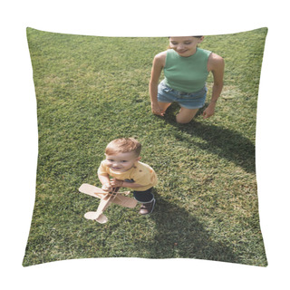 Personality  Top View Of Happy Young Mother Looking At Cheerful Toddler Son With Toy Biplane And Standing On Grass Pillow Covers