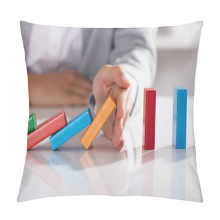 Personality  Close-up Of Businessperson Hand Stopping Colorful Blocks From Falling On Table In Office Pillow Covers
