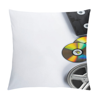 Personality  Top View Of CD Discs, VHS Cassette And Film Reel On White Background Pillow Covers