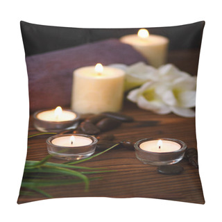 Personality  A Candle In A Glass Vase, Decoration And Various Interesting Elements On A Dark Wooden Background. Candles Burning. Set For Spa And Massage. Pillow Covers