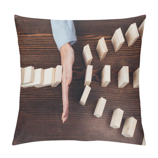 Personality  Cropped View Of Woman Preventing Wooden Blocks From Falling At Desk Pillow Covers