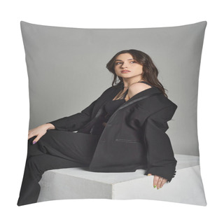 Personality  A Beautiful Plus Size Woman In Stylish Attire Sitting Regally On A White Block Against A Gray Backdrop. Pillow Covers