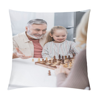 Personality  Smiling Senior Man Pointing With Hand At Chessboard Near Granddaughter And Blurred Wife Pillow Covers