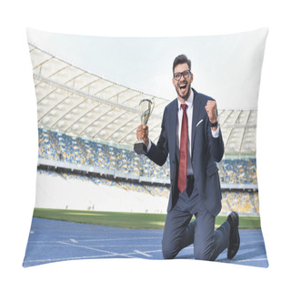 Personality  Happy Young Businessman In Suit Standing On Knees On Running Track With Trophy At Stadium Pillow Covers