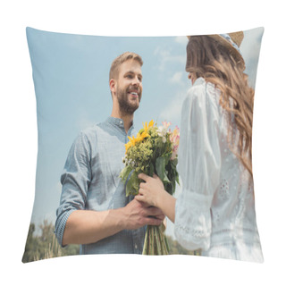 Personality  Low Angle View Of Cheerful Man Presenting Bouquet Of Wild Flowers To Girlfriend With Blue Sky On Background Pillow Covers