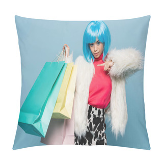 Personality  Stylish Asian Woman In Bright Wig Pointing At Shopping Bags Isolated On Blue  Pillow Covers
