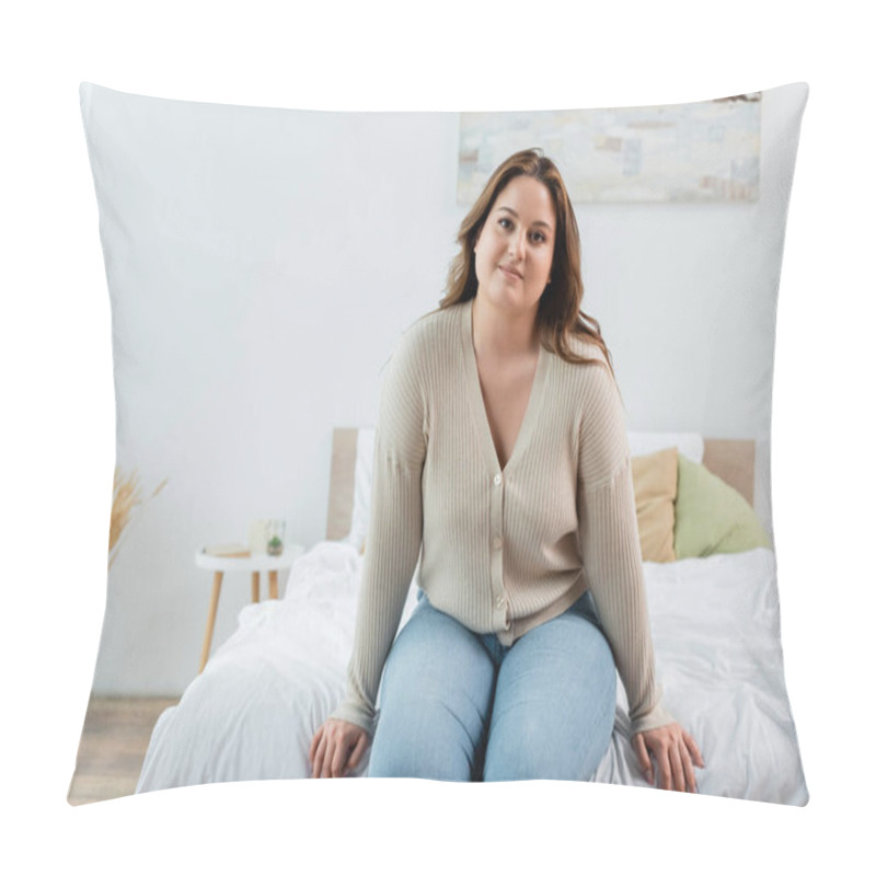 Personality  Smiling woman with overweight sitting on bed at home  pillow covers