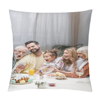 Personality  Smiling Man Showing Smartphone To Amazed Family During Easter Dinner Pillow Covers
